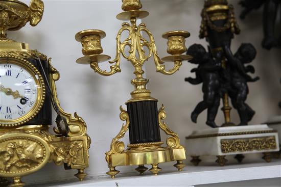 A late 19th century French bronze and ormolu clock garniture, 11.5in.